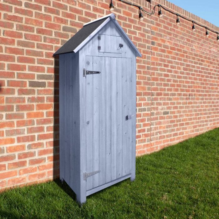 A light blue garden storage shed outside a house.