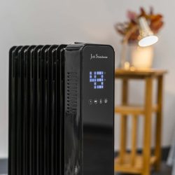 back oil filled radiator by Jack Stonehouse. Displaying 43 degree temperature on a digital screen