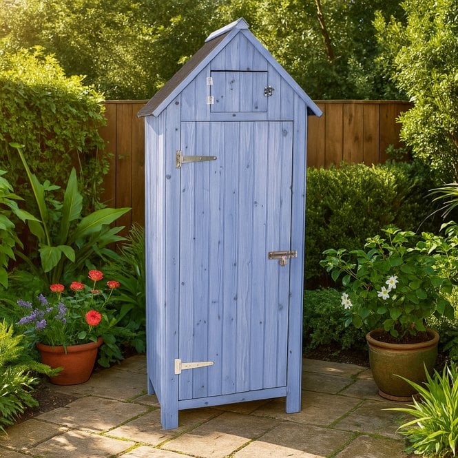 A blue tall storage shed sat in a garden.