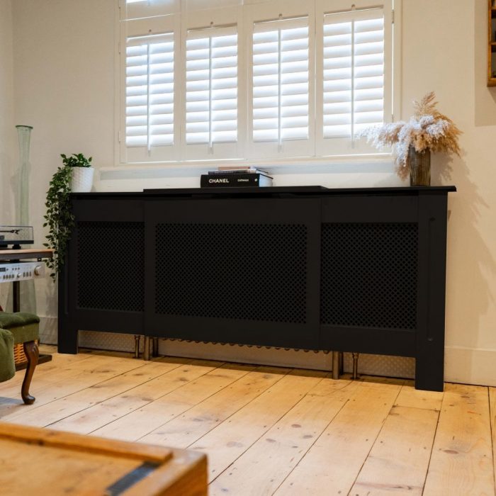 Black long radiator cover in a living room