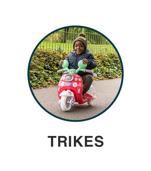Little boy on a kids trike